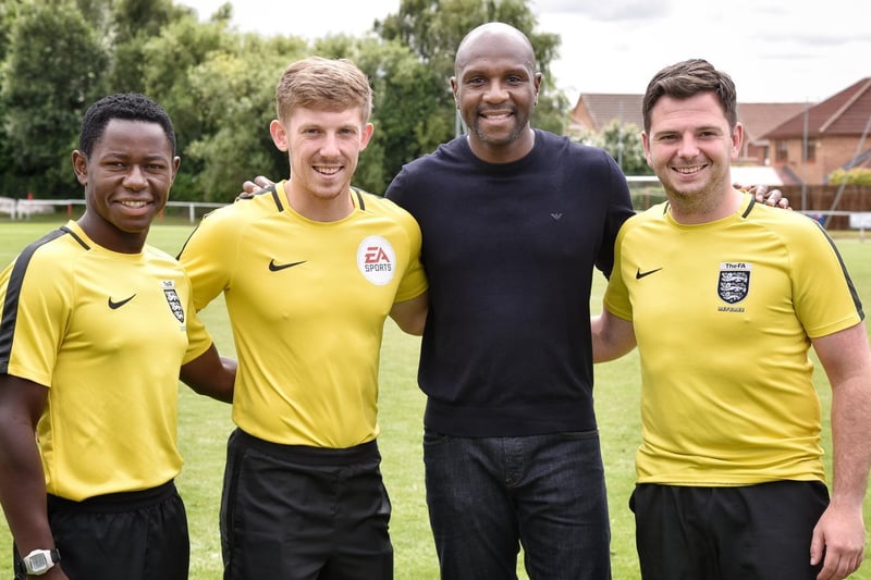 Emmerson Boyce with the officials