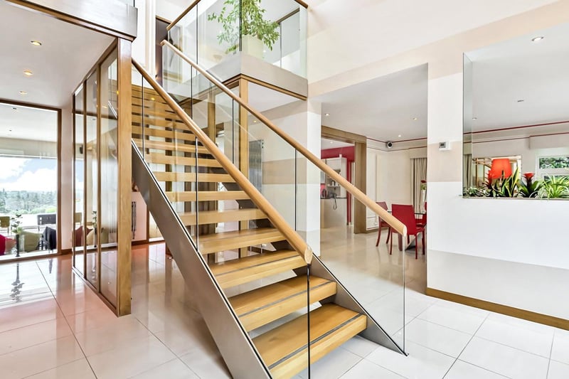 Enter into the double height reception hall, boasting an elegant grand central staircase. The hallway provides access to all the main rooms, and also to a useful study, WC, and utility area.