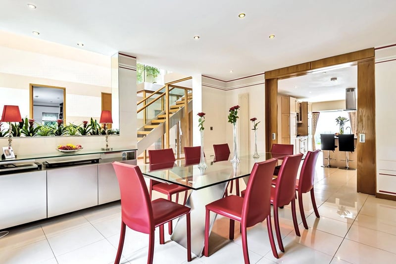 The open plan hallway leads into the light and airy dining room, spacious enough for a large dining table, making it the perfect space for entertaining guests. This room also benefits from a gas fire and wall mounted speakers.