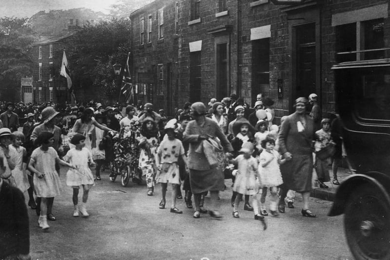 A section of Chapel Allerton Carnival procession passing the Regent Inn on Regent Street in June 1920.