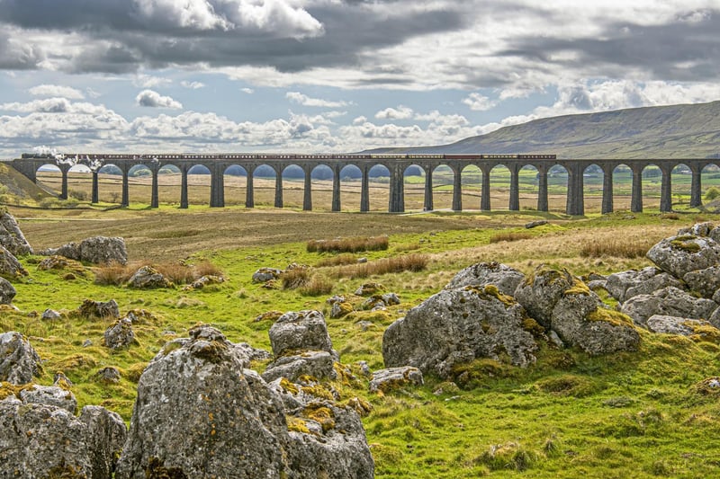 The Ribblehead Viaduct is a stunning landmark situated in the North Yorkshire countryside, right on the Cumbrian border. This breathtaking 4-mile hike initially follows the Settle-Carlisle railway line, before heading up toward the small, cobbled village of Dent.