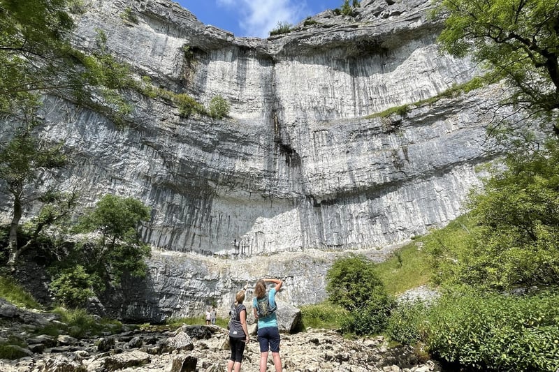 This natural beauty spot is a curved limestone formation standing 70 metres high above the Yorkshire Dales. Thanks to its horseshoe shaped cliff face, Malham Cove offers many options for climbers looking to scale its white limestone.