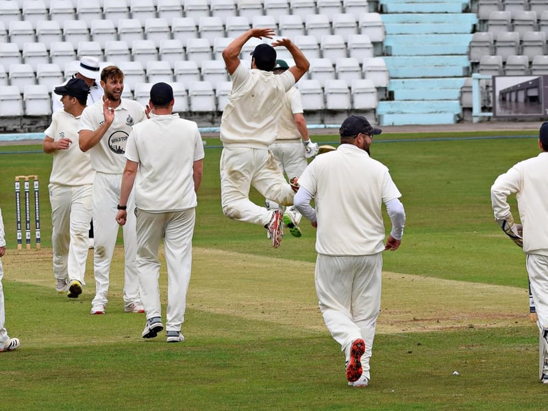 Scarborough CC celebrate wicket v Harrogate CC
Photo by Simon Dobson