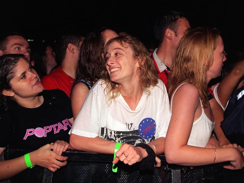 Heavy rain before U2 appeared on stage failed to dampen the spirts of concert-goers.