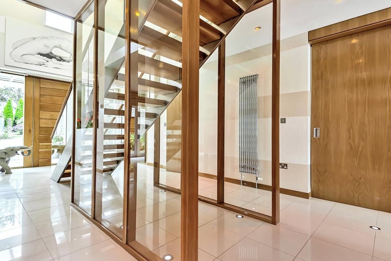 The stunning wood and glass staircase leads to the first floor where four double bedrooms and the bathrooms can be located.