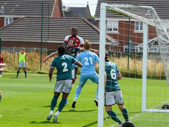 Darnell Johnson climbs highest for a corner but Fleetwood could not breach the Wrexham defence