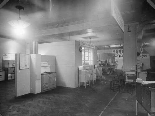 In view are a number of cookers at the 1944 exhibtion. To the left is a solid fuel cooker, this model is called a 'Yorkdale'. In the centre are several small electric models with solid rings, grill, oven and pan rack underneath.