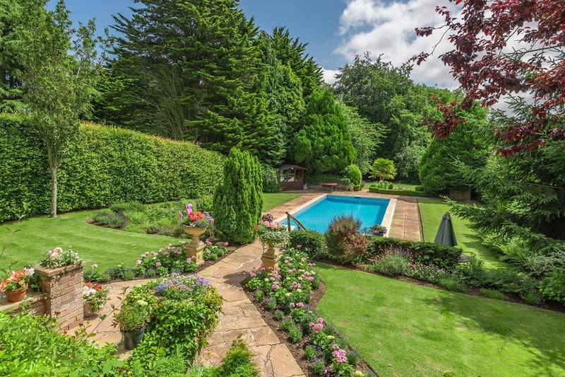 A view of the well stocked gardens and the approach to the swimming pool