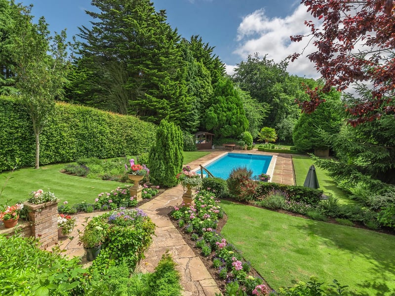 A view of the well stocked gardens and the approach to the swimming pool