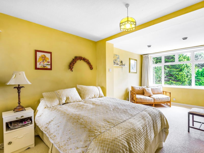 A great deal of space for a vafiety of uses within this sunny bedroom