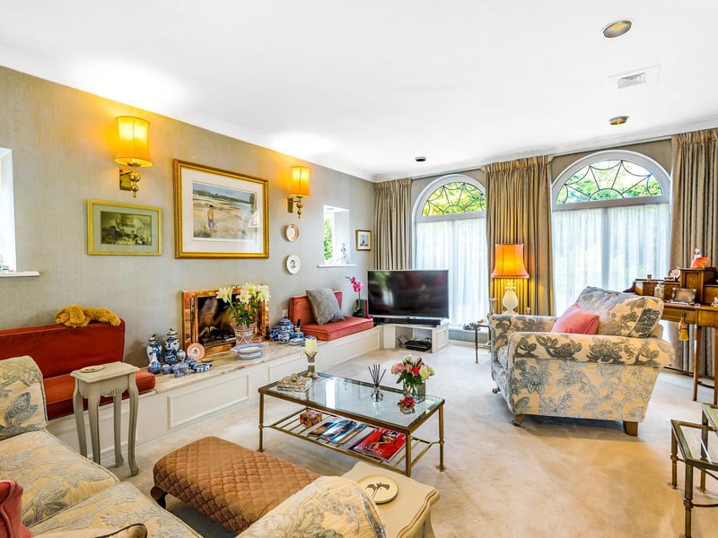 An elegant living room with feature arched windows
