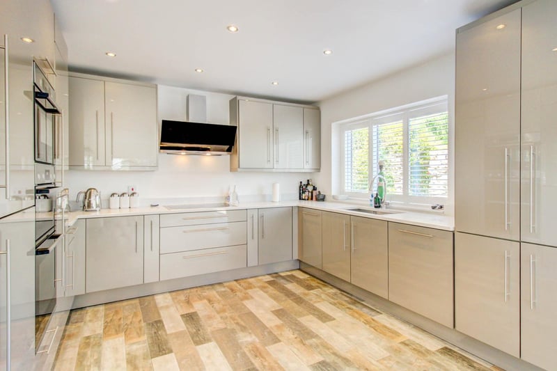 The house also includes a fantastic high-gloss kitchen fitted with crucial appliances.