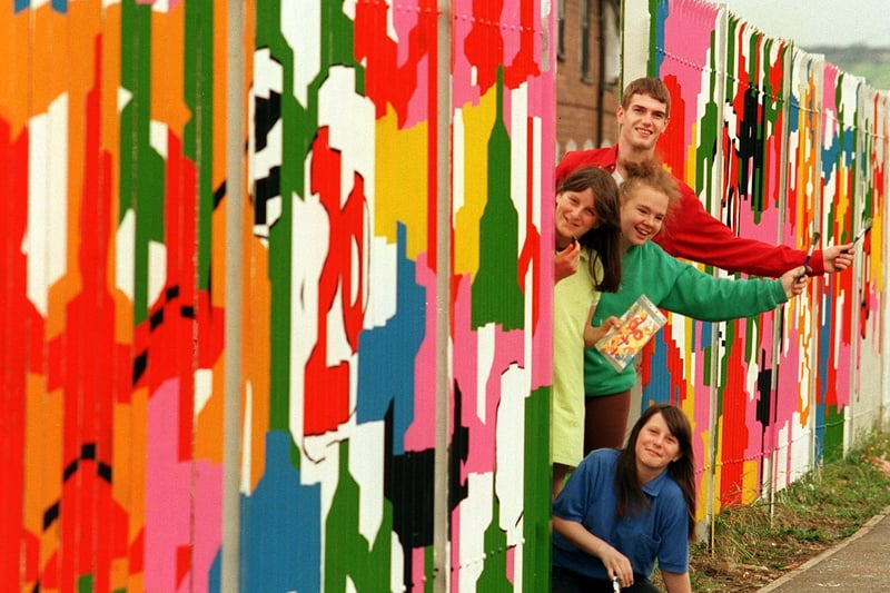 Teenagers from Fairfield Youth Centre in Bramley paint a mural on the fence surrounding the  building. Pictured are Shantell Dixon (bottom), Danielle Dixon, Lisa Partridge and Craig Croft.