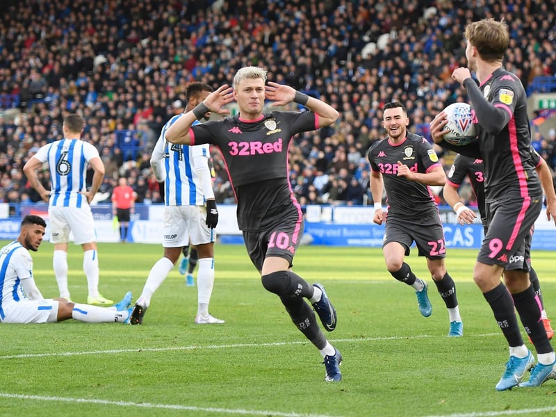 Ezgjan Alioski celebrates after scoring Leeds United's first goal during the Championship clash against Huddersfield Town at the John Smith's Stadium in December 2019.