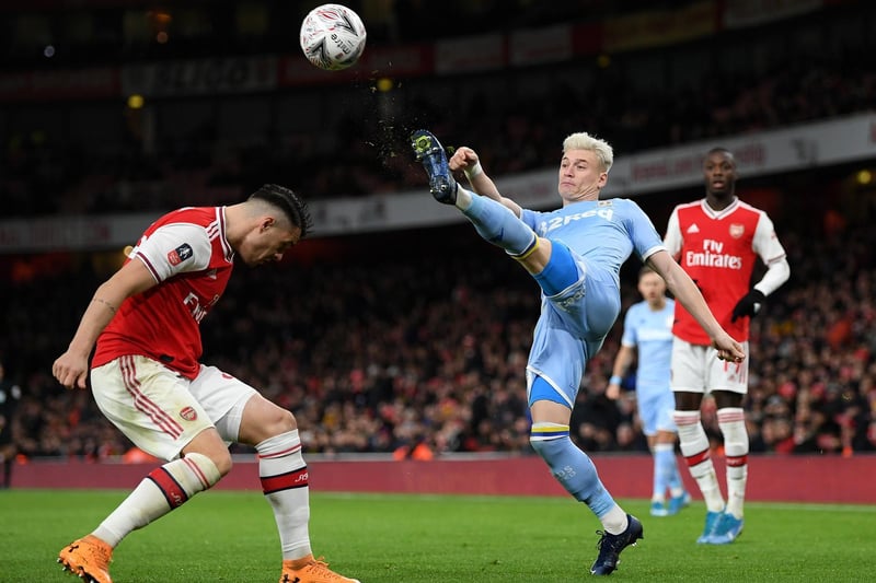Ezgjan Alioski clears the ball under pressure from Arsenal's Granit Xhaka during the FA Cup third round clash at the Emirates Stadium in January 2020.