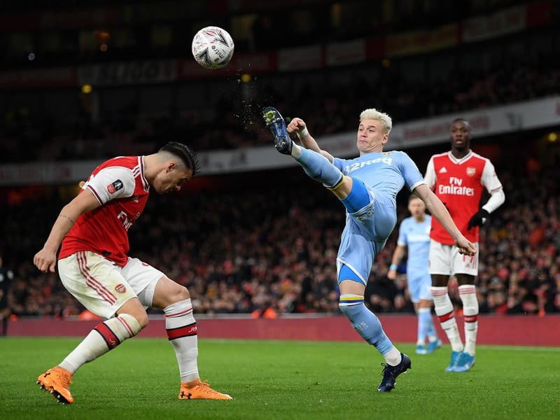 Ezgjan Alioski clears the ball under pressure from Arsenal's Granit Xhaka during the FA Cup third round clash at the Emirates Stadium in January 2020.