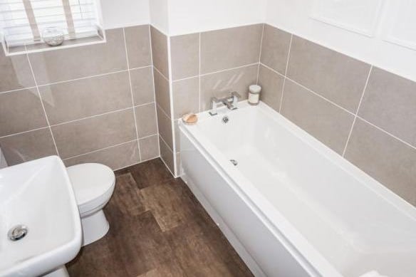 The family bathroom has a luxury suite comprising of a panelled bath, low level WC, pedestal wash hand basin, low voltage inset spotlights, part tiled walls and a frosted double glazed window.