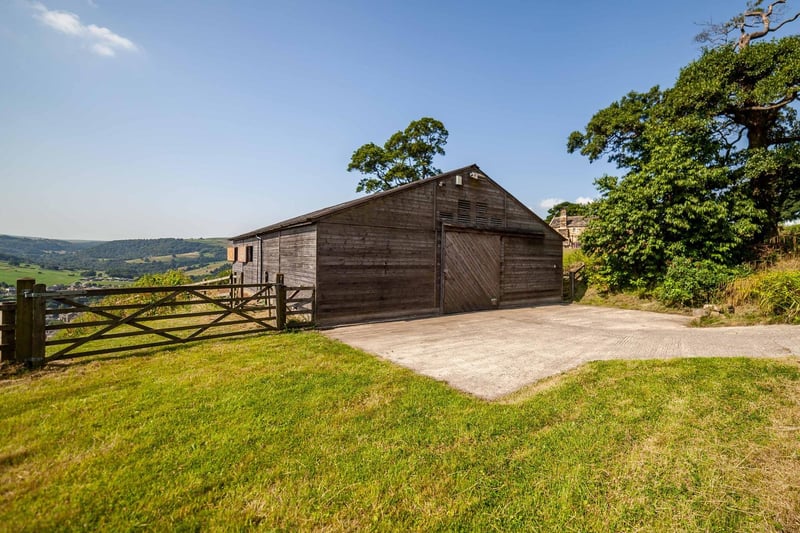 Stables for four horses, a tack room and storage are within this building