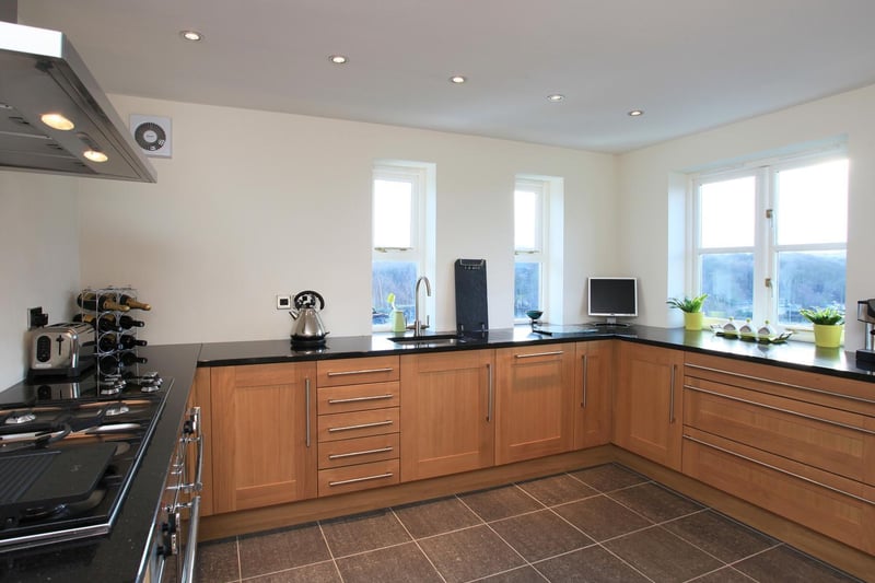 The modern, well lit kitchen within the property