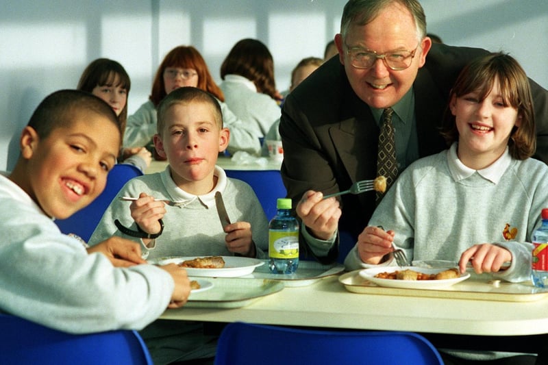 Colin Richardson, headteacher at Cockburn High, is pictured in the school's new dining area with Year 7 pupils, from left, Tyrone Clarke, Stuart Wood and Zoe Mitchell.