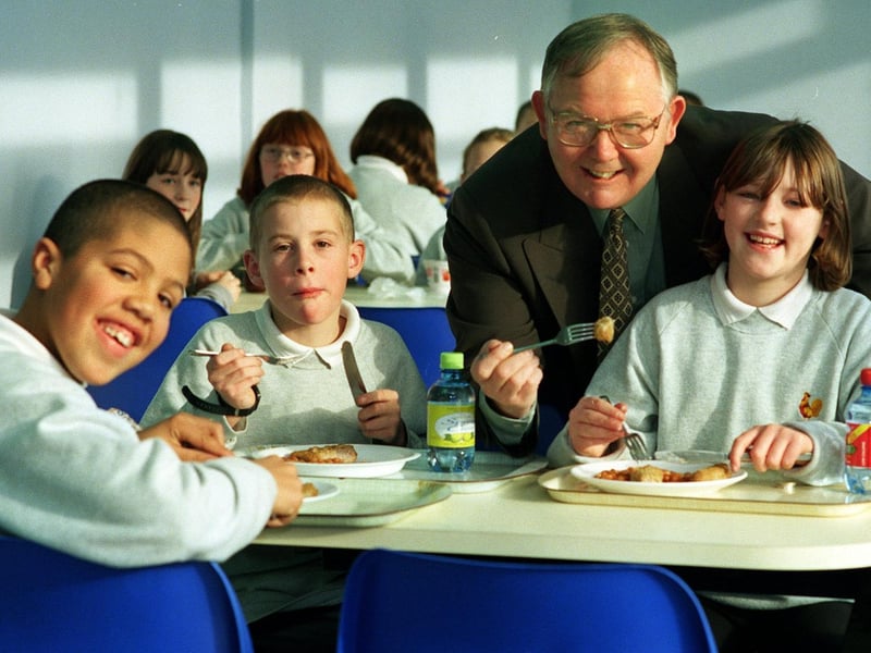 Colin Richardson, headteacher at Cockburn High, is pictured in the school's new dining area with Year 7 pupils, from left, Tyrone Clarke, Stuart Wood and Zoe Mitchell.
