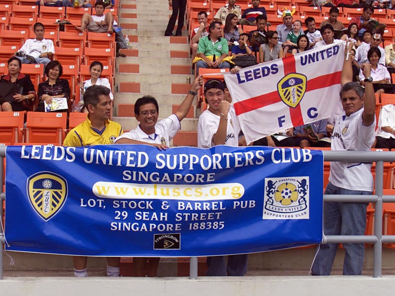 The Leeds United Supporters Club of Singapore show their support before kick off.
