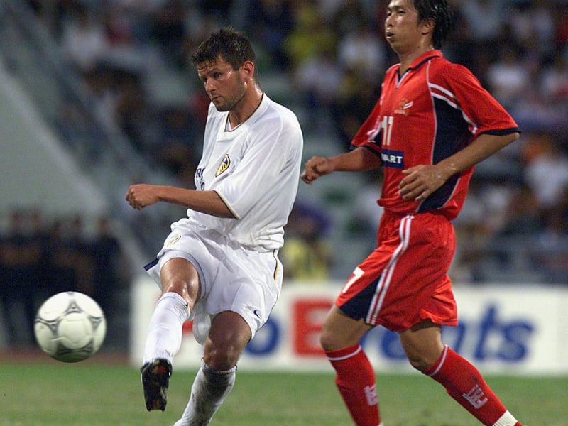 Midfielder Eirik Bakke unleashes a shot to score the first goal as D. Chalermsan looks on helplessly.