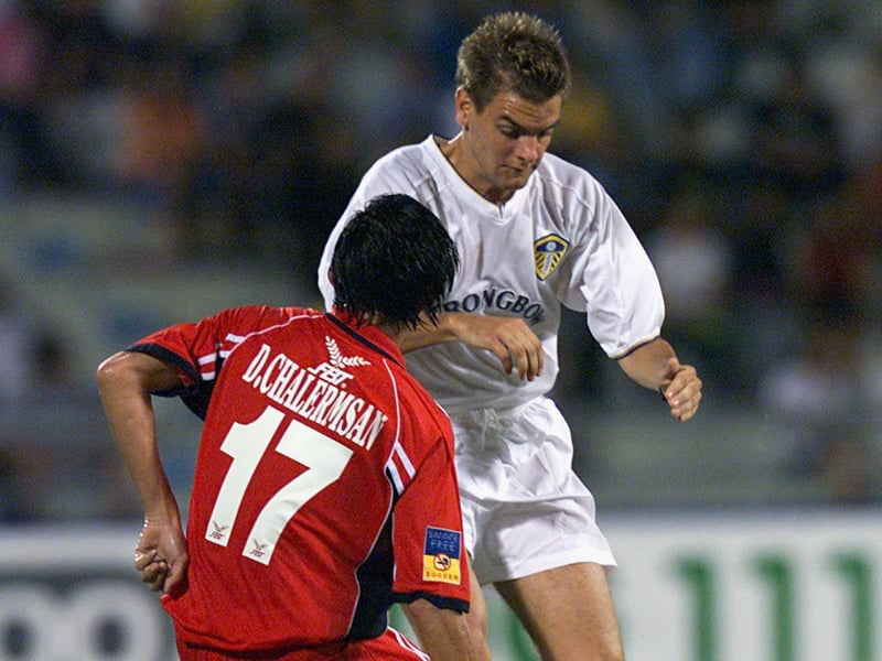 Jonny Woodgate is checked by with D. Chalermsan.