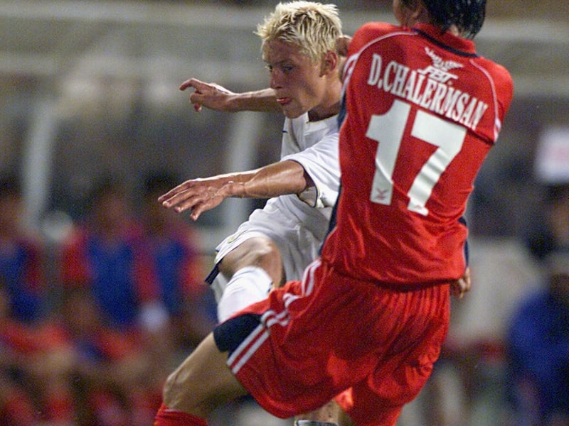 Striker Alan Smith fires towards goal.