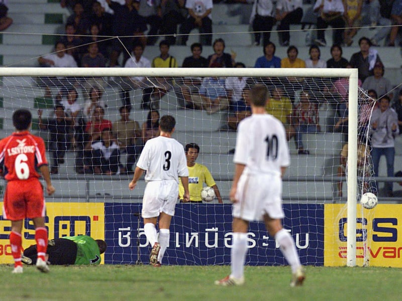 Kiatisuk Senamuang ( not in picture ) scores for the Bangkok XI just before half-time.