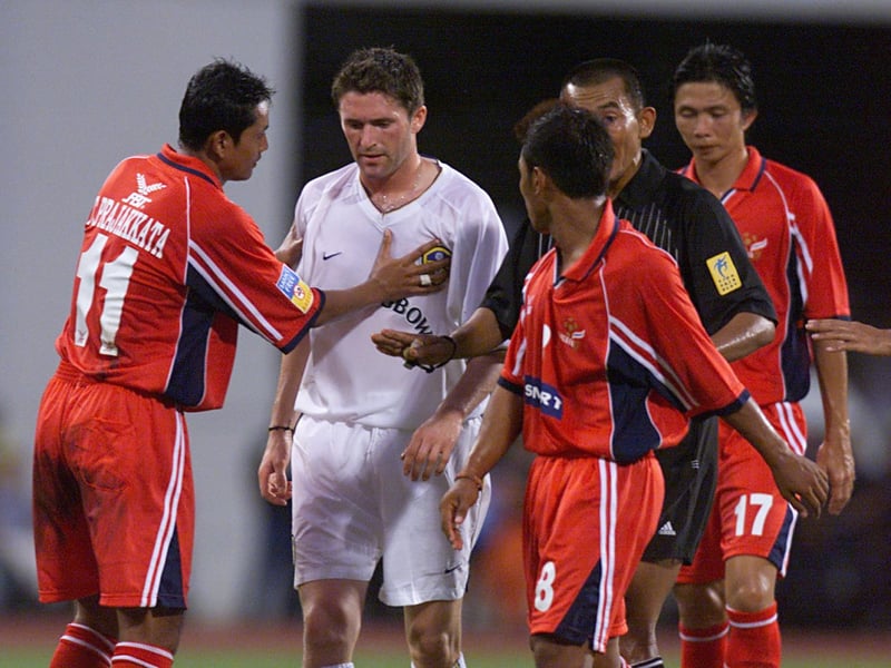 Robbie Keane has to be calmed down by the opposition.