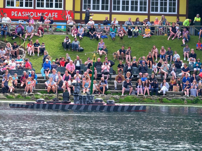 Crowds gather as the enemy boat approaches...