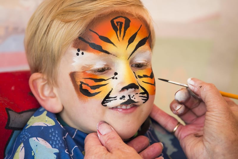 Leo Harrison, five, gets his face painted at Brodstock.