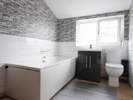 Storage space is included in this stylish bathroom