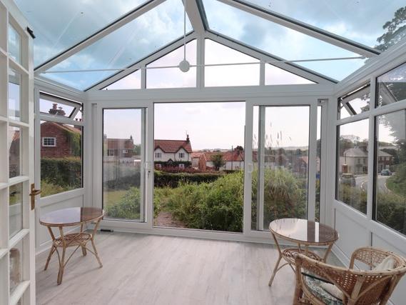 Patio doors lead out to the garden from the conservatory
