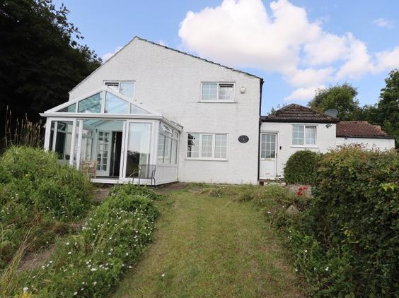 View of the rear of the property from the well stocked garden