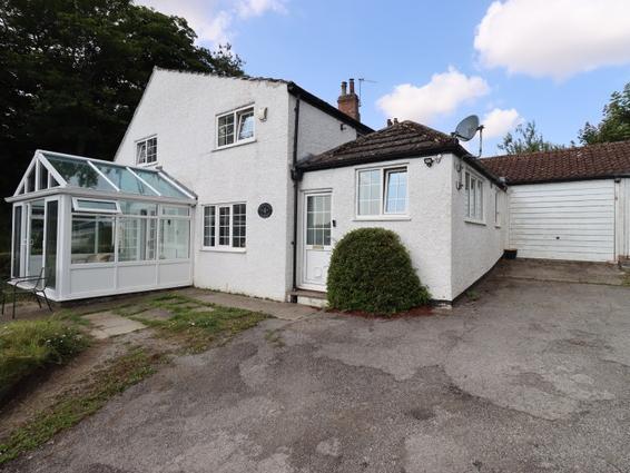 The approach to the 18th century cottage that has far reaching views