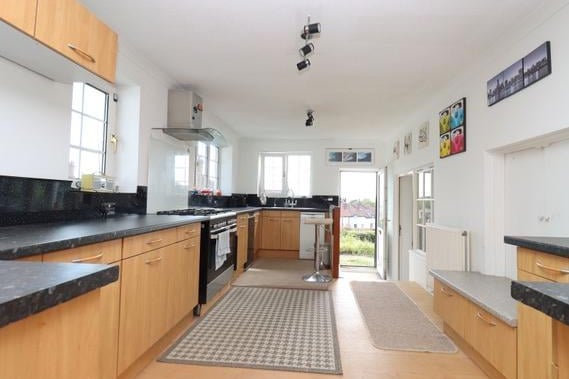 The kitchen is spacious with an open plan element