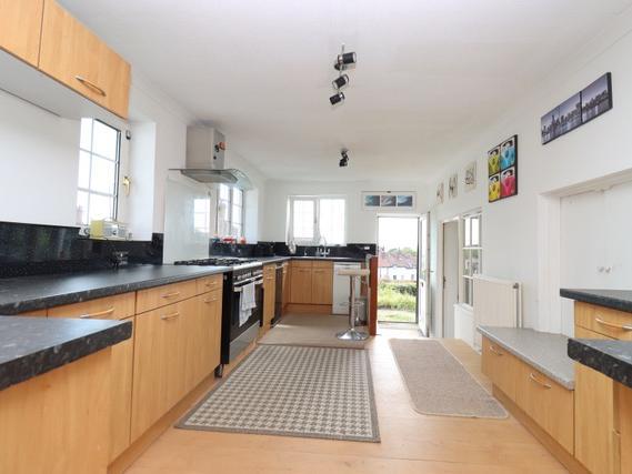 The kitchen is spacious with an open plan element