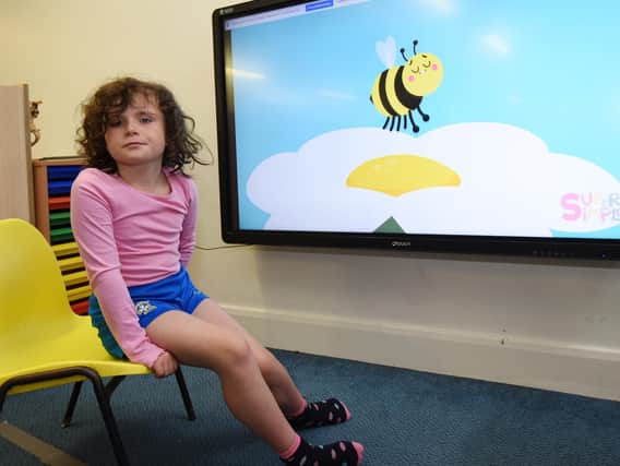Kids get involved in the bee-themed project