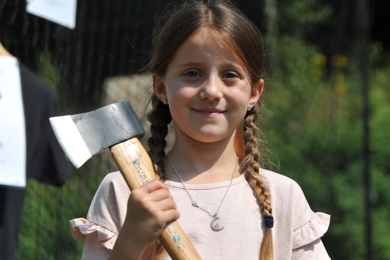 Isla-Grace Wilkinson, seven, has a go at axe throwing at TimberJacks.