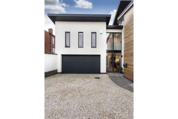 A private gated driveway provides access to the double garage.