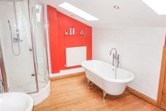 The family bathroom is a spacious and modern suite comprising of a free standing roll top bath with a shower attachment and also a walk in shower cubicle. it benefits from under eaves storage space.