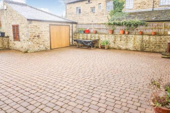 A fabulous courtyard to the rear of the property that provides off street parking for several cars.