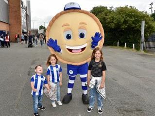 These young fans with Latics' mascot