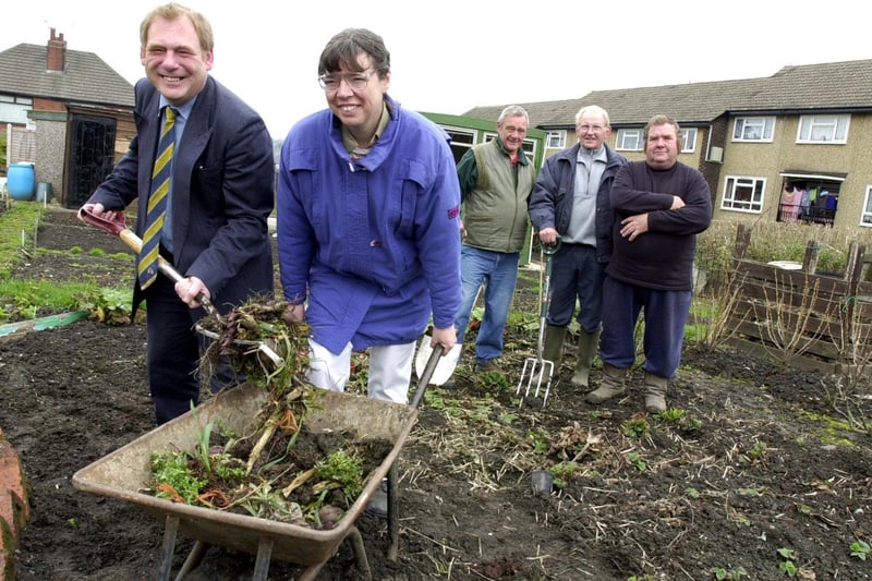 Councillors David Blackburn and Claire Nash help out at the New Wortley allotments after donating money for a new office at the site. Looking on in April 2001 are committee members Len Capstick, Gordon Metcalfe and Bill Walsh. Picture: Tony Johnson