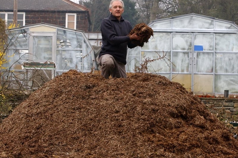 Geoff Whiteley, a senior lecturer at the University of Leeds Biology Department, is pictured in the university gardens in April 2004 as he stands on top of a pile of Strulch, a mineralised straw mulch for gardens, allotments and flowerbeds. Picture: Gerard Binks