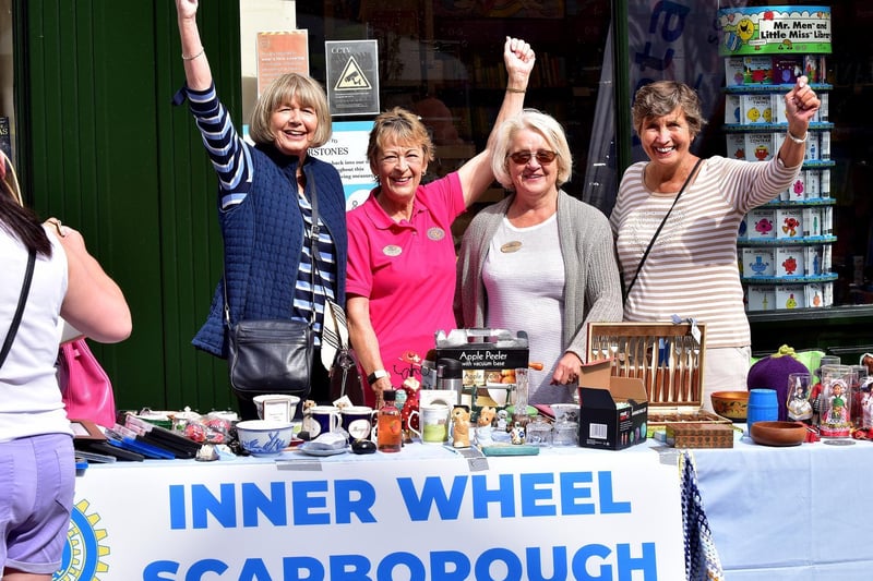 The Scarborough Inner Wheel team raise a cheer at their stall.