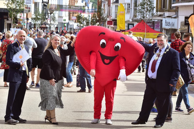 Mayoress and Mayor Lynne and Eric Broadbent bump into a giant heart in the town centre.