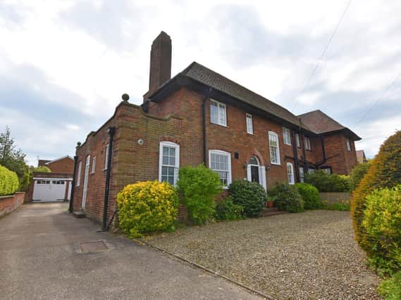 The attractive frontage and driveway to the four-bedroom property